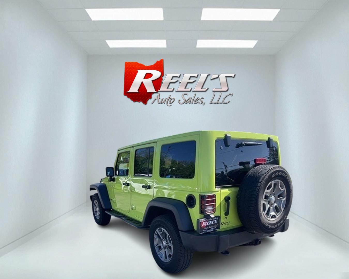 2017 Green /Black Jeep Wrangler Unlimited Rubicon 4WD (1C4BJWFG2HL) with an 3.6L V6 DOHC 24V engine, 5-Speed Automatic transmission, located at 11115 Chardon Rd. , Chardon, OH, 44024, (440) 214-9705, 41.580246, -81.241943 - This 2017 Jeep Wrangler Unlimited Rubicon is a rugged and capable off-road vehicle, equipped with a range of premium features. The exterior boasts LED headlights and fog lights, while the interior features a single-zone automatic climate control system, a 9-speaker Alpine sound system, and navigatio - Photo#7